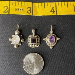 Sterling silver pendants.  They are marked 925.